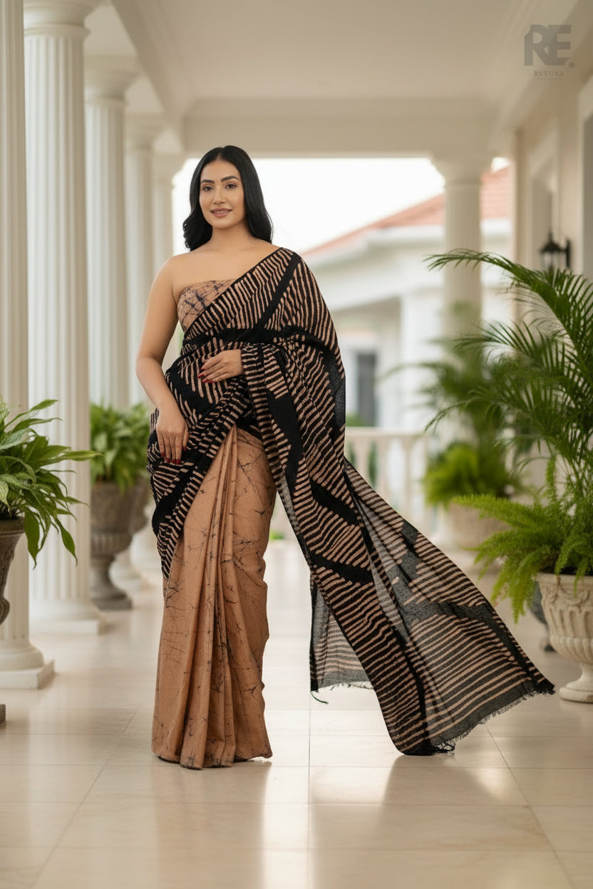 Woman wearing a black and beige handcrafted batik saree with bold linear patterns — Batik Saree RE-0107 I REYONA 