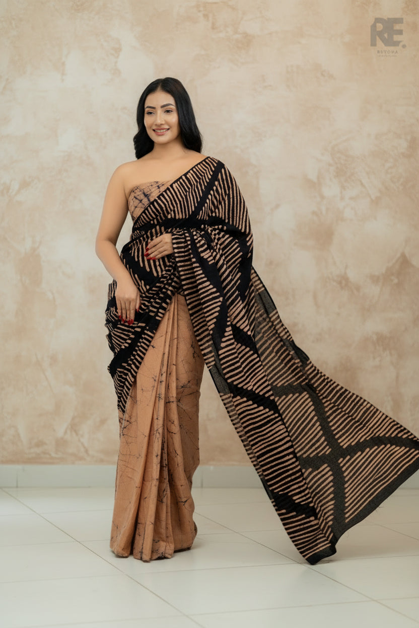 Woman wearing a black and beige handcrafted batik saree with bold linear patterns — Batik Saree RE-0107 I REYONA Clothing