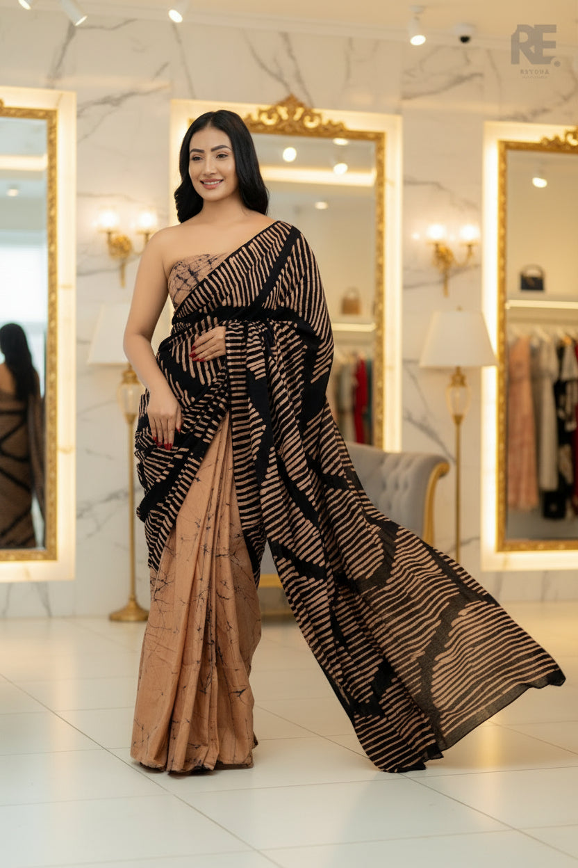 Woman wearing a black and beige handcrafted batik saree with bold linear patterns — Batik Saree RE-0107