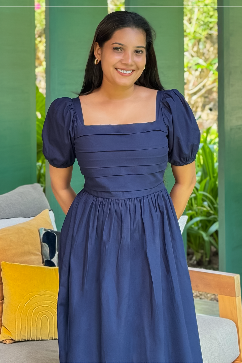 Bella navy blue midi dress with pleated bodice and puff sleeves