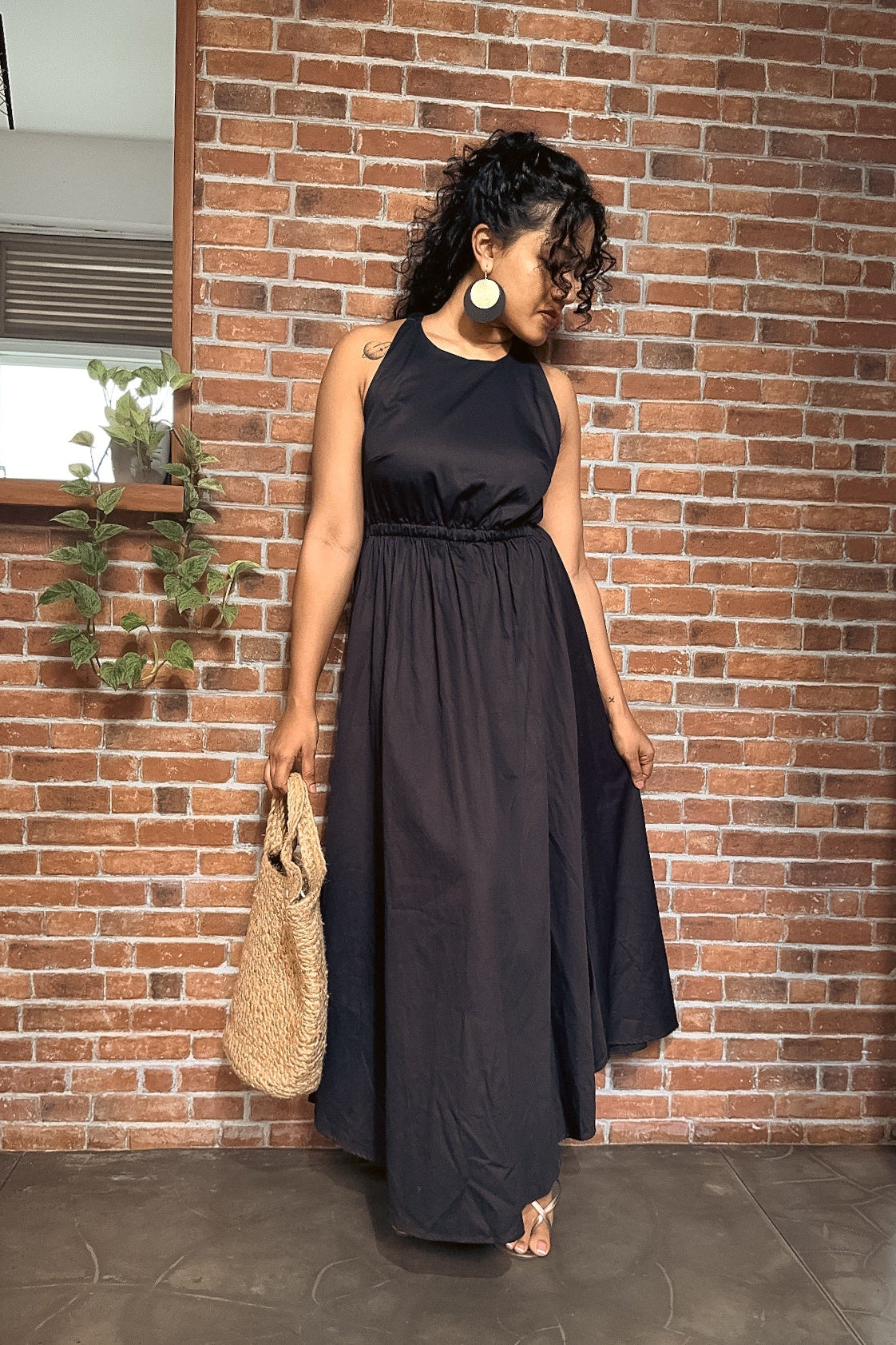 Flared black maxi dress suitable for summer occasions