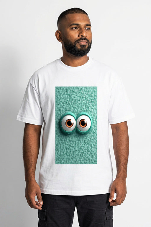 Male model wearing a white unisex graphic T-shirt featuring a playful turquoise 3D eyes design by REYONA.