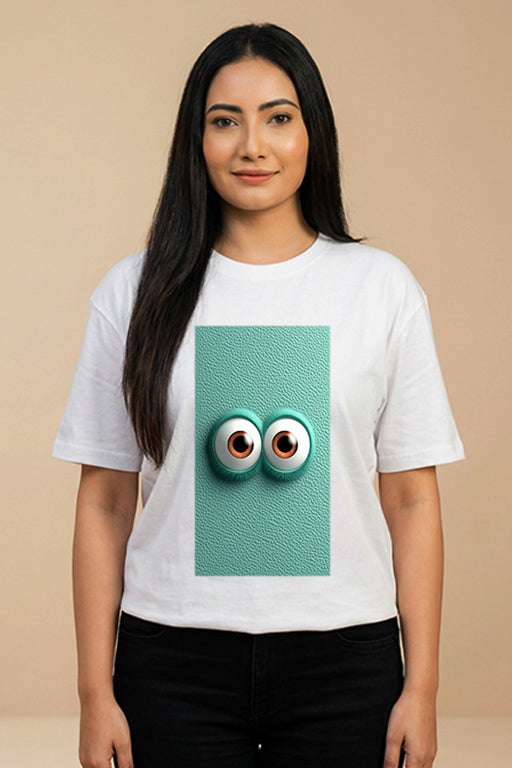 Female model wearing a white graphic T-shirt with a colorful 3D eyes design by REYONA.