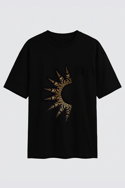 Black oversized unisex T-shirt featuring a gold abstract ornamental graphic on the front by REYONA
