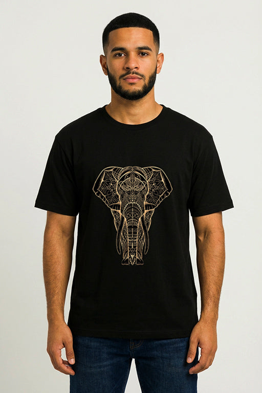 Male model wearing a black oversized graphic T-shirt featuring an intricate gold elephant design by REYONA.