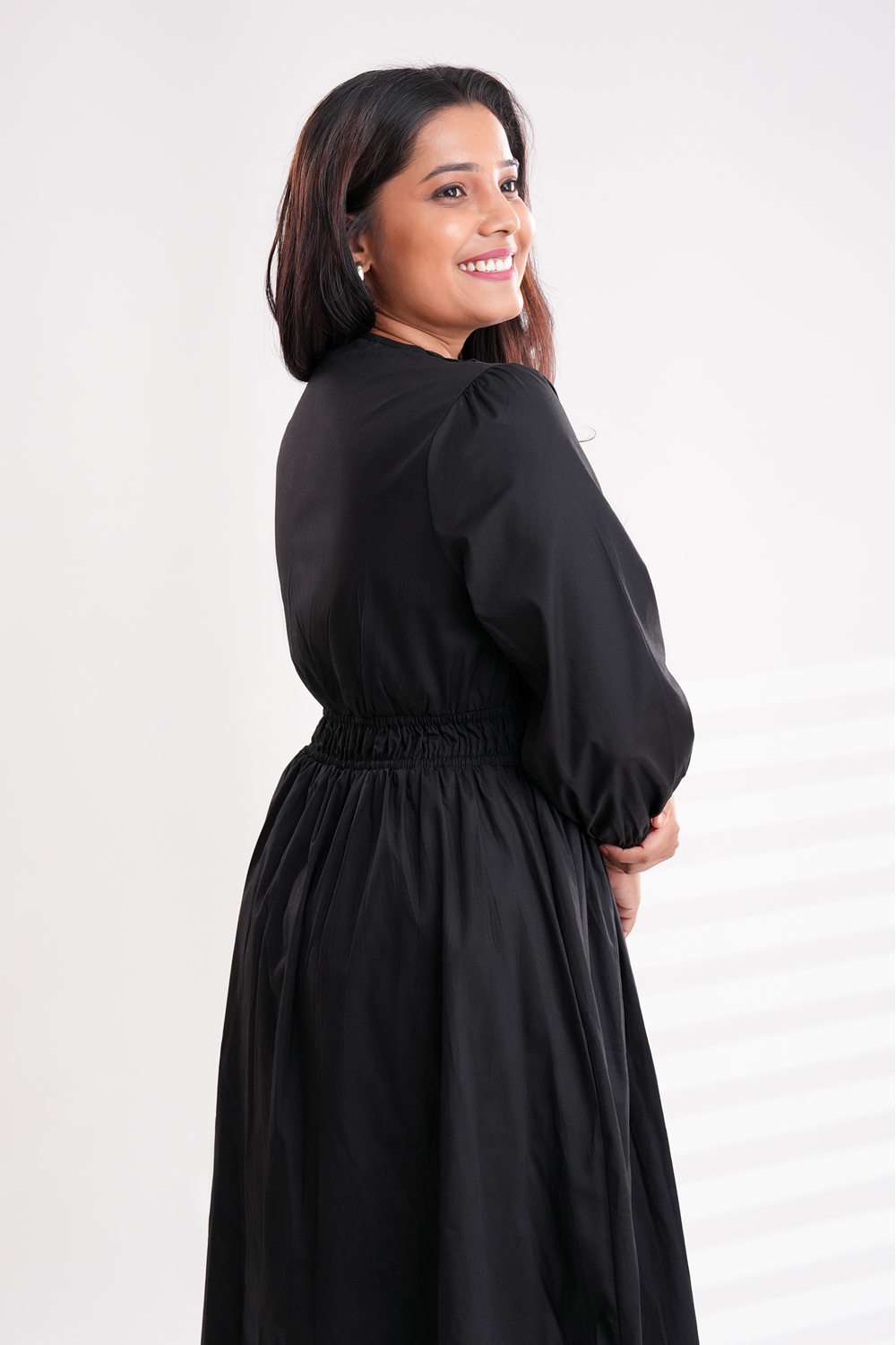 Black midi dress suitable for office and casual wear