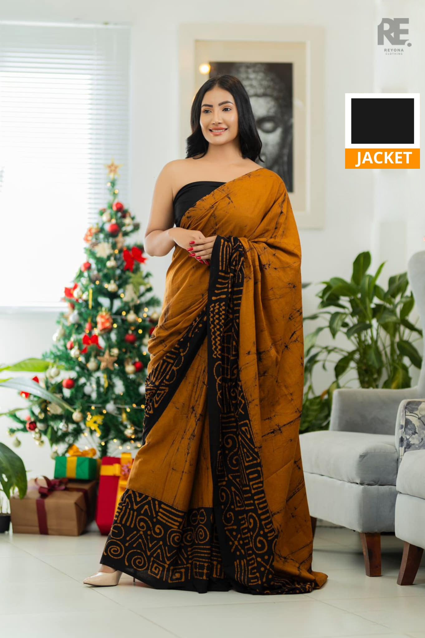 Woman wearing mustard brown handcrafted cotton batik saree – Reyona