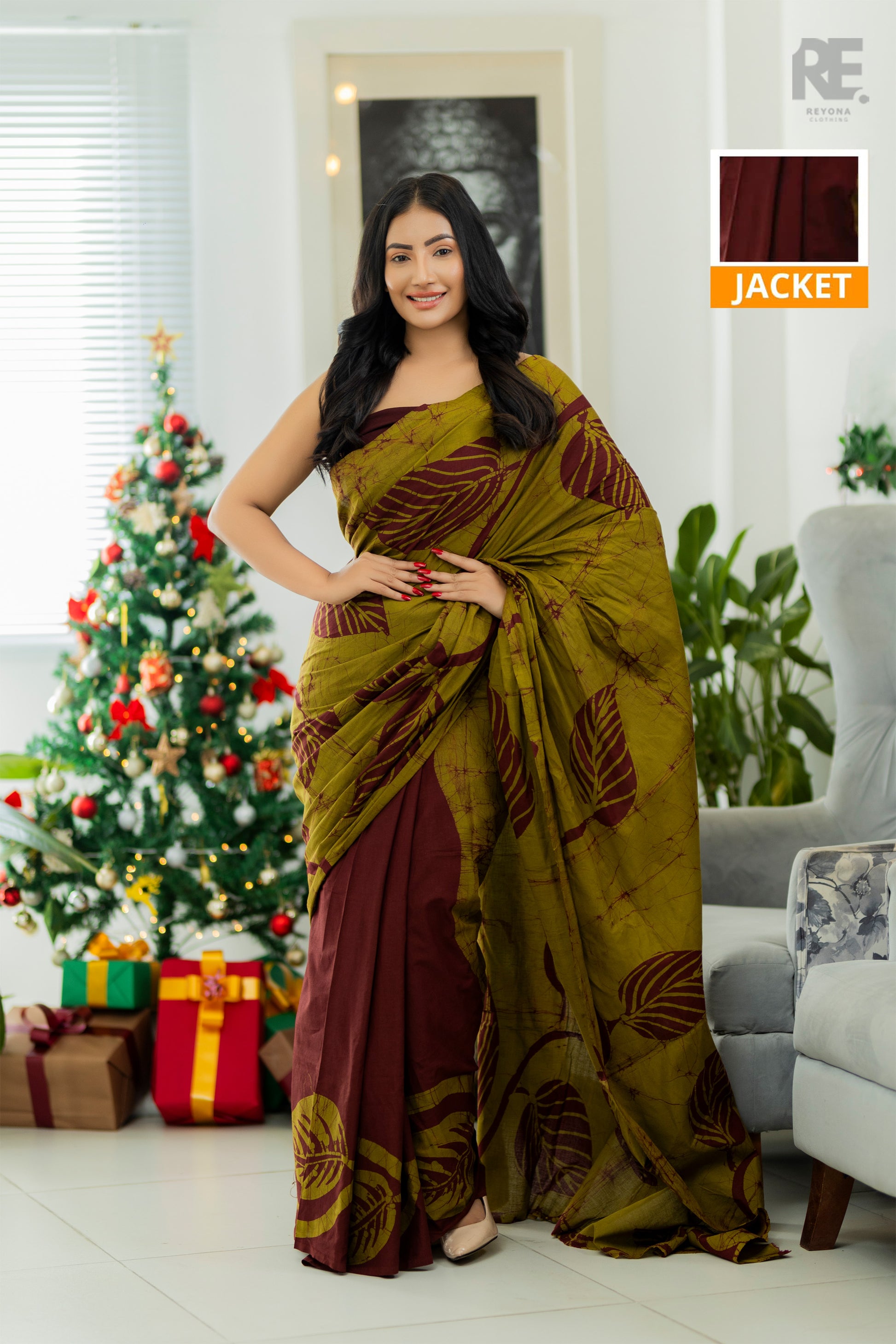 Woman wearing olive green and maroon handcrafted cotton batik saree – Reyona ethnic wear