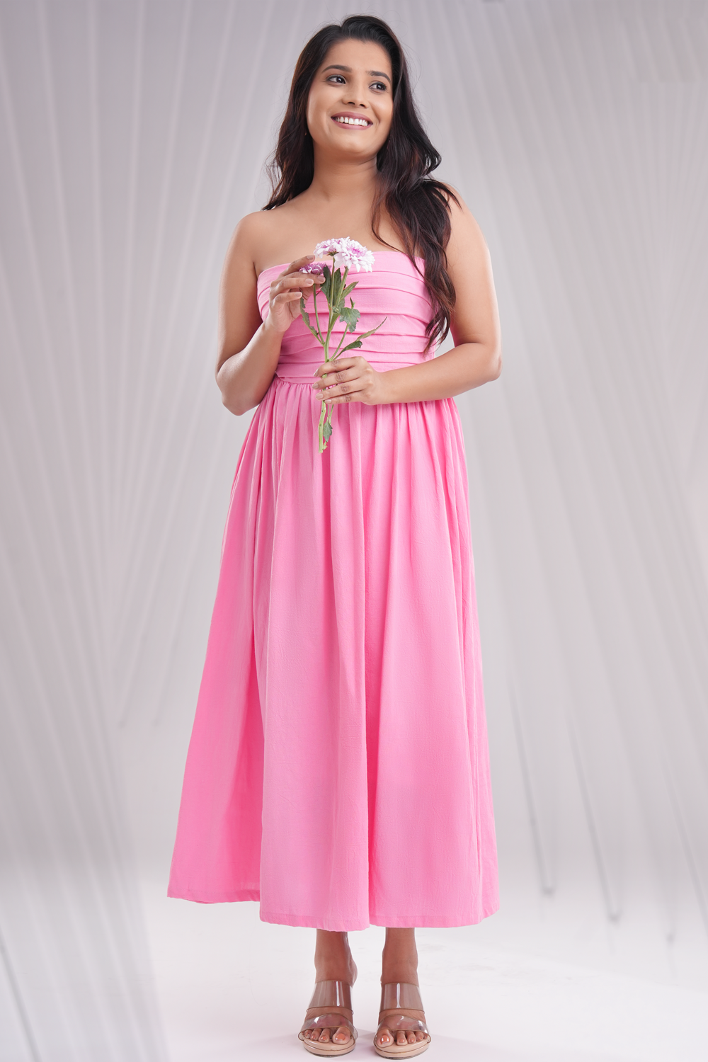 Back view of peach midi dress with elasticated back