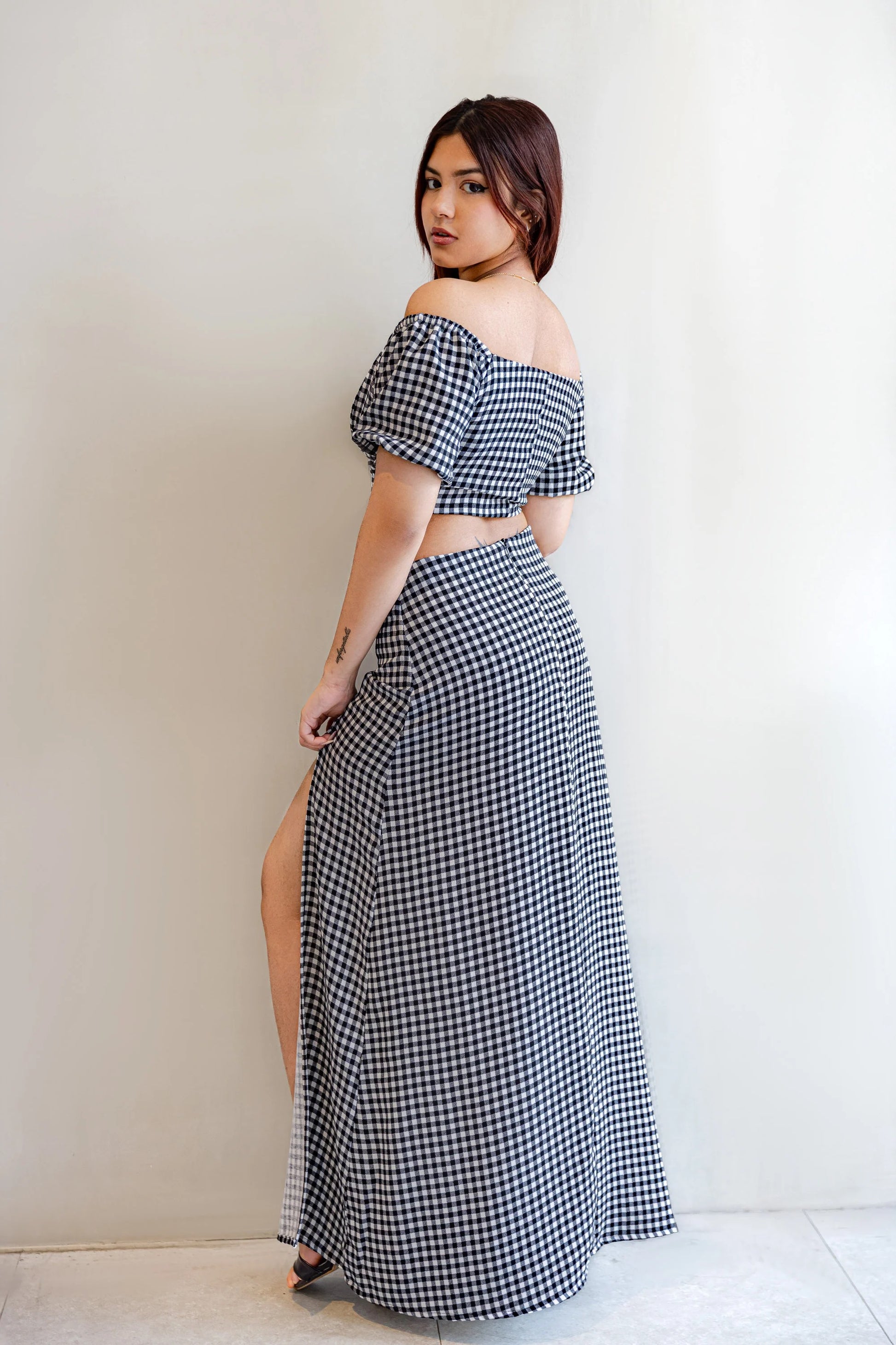 Back view of SERAC co ords off shoulder crop top and skirt