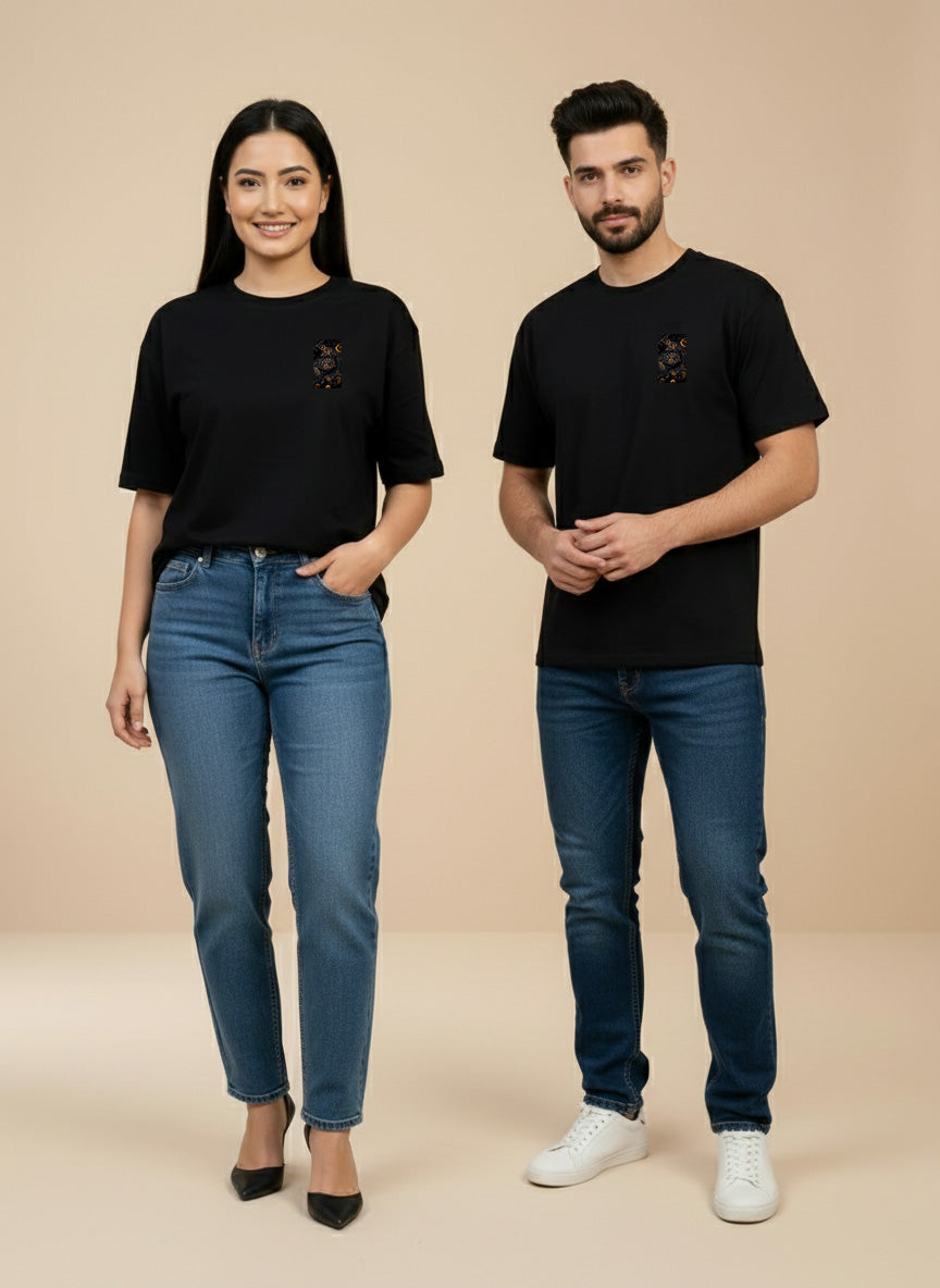 Male and female models wearing black unisex graphic T-shirts featuring vintage mechanical watch artwork by REYONA.